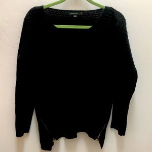Black sweater with gold zippers on the sides
